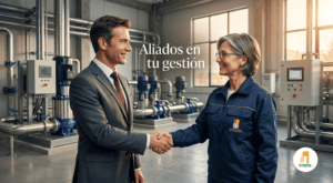 Administrador estrechando la mano con ingeniero de SYRBON en sala de máquinas.